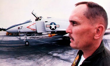Robert Duvall standing near a fighter jet