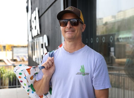 Greg Veros in cap and sunglasses outside in Brighton