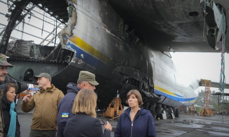 France's Foreign Minister, Catherine Colonna, right, stands near the remains of the Antonov An-225, the world's biggest cargo aircraft, which was destroyed during fighting between Russian and Ukrainian forces, at the Antonov airport in Hostomel, on the outskirts of Kyiv.