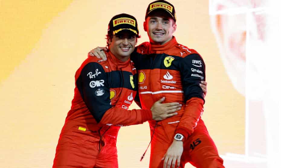 Charles Leclerc celebrates on the podium with his Ferrari teammate Carlos Sainz, who came second
