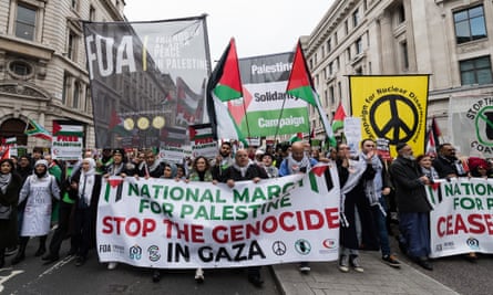 Tens of thousands of protesters in London march in solidarity with the Palestinian people and to demand an immediate ceasefire to end the war on Gaza.
