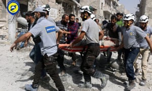 Rescue workers come to the aid of civilians after an airstrike on the al-Sakhour neighbourhood in rebel-held eastern Aleppo, Syria. 
