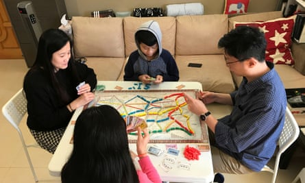 A family in Hong Kong play board games amid the coronavirus outbreak.