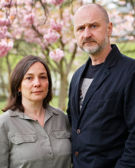 Mark and Ros Dowey pose for a photo in a garden