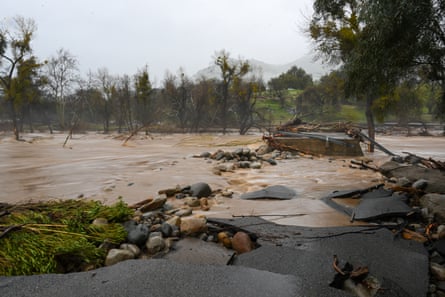 A road was washed away during heavy rain in Springville, California.