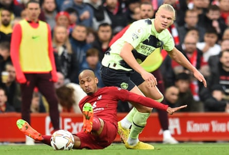 Fabinho falls after his shirt is pulled by Erling Haaland – leading to Manchester City’s goal being disallowed.