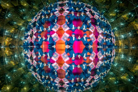 Performer Fintan McCarney poses with an oversized cut-out of the Edinburgh fringe festival programme within Camera Obscura’s Giant Kaleidoscope in Edinburgh for the festival programme launch