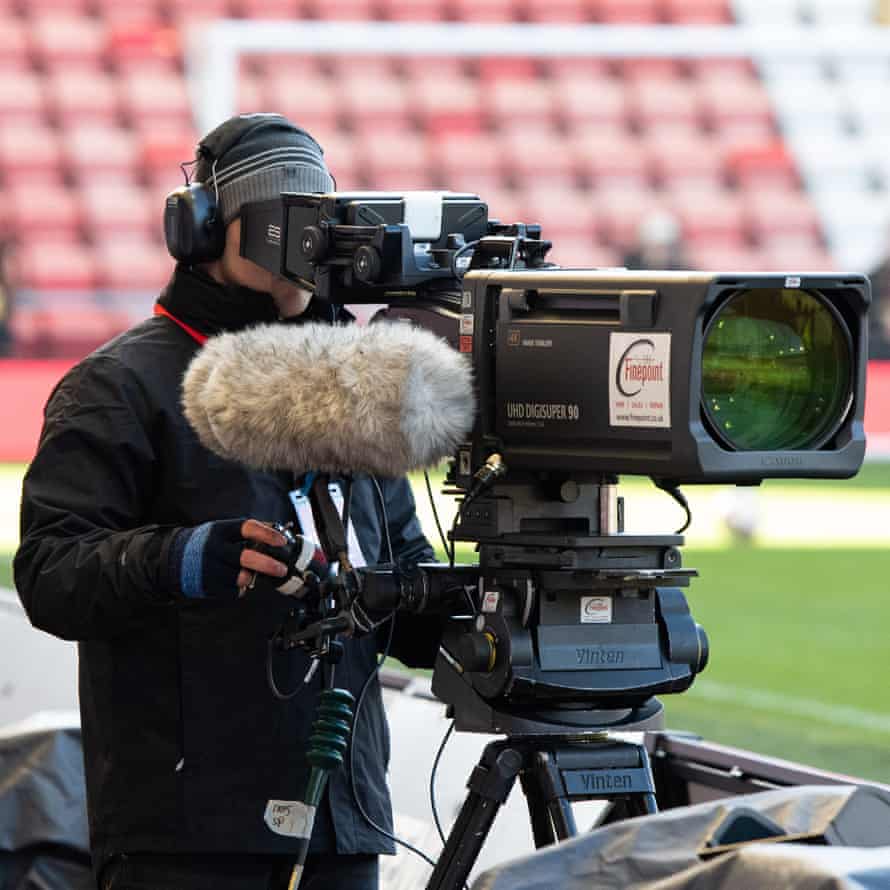 A BBC cameraman moves into position.