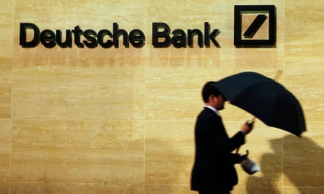 A man walks past Deutsche Bank offices in London