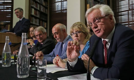 European Research Group chairman Jacob Rees-Mogg (L) listens as Britain’s former Brexit minister David Davis (R) speaks during a meeting of the ERG on 12 September 2018