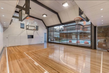 A private indoor gymnasium with basketball hoops