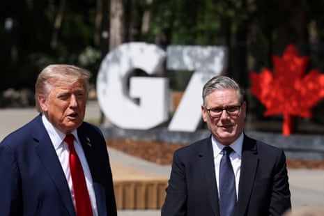 Two men stand before a sign reading “G7”.