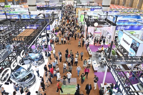 Visitors view new energy vehicles at the China Import and Export Fair in Guangzhou