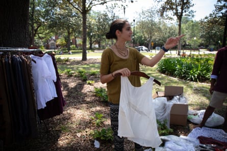 Kira Janock organizes clothes being given away for free at the Krishna lunch on the Plaza of the Americas on University of Florida’s campus in Gainesville.