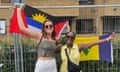 Sarah (left) and Joanna posing with the flags of Antigua and Barbuda and St Vincent and the Grenadines respectively in London, 2021