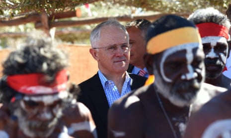 Australian Prime Minister Malcolm Turnbull is surrounded by aboriginal dancers as he attends the Kenbi Native land claim ceremony near Darwin, Tuesday, June 21, 2016.