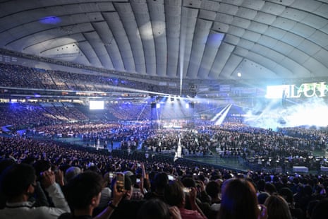 A sold-out crowd of about 55,000 fans await the main event at the Tokyo Dome.