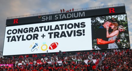 A New Jersey scoreboard displays a congratulations message to Taylor Swift and Travis Kelce on their engagement