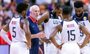 USA head coach Gregg Popovich talks to Kemba Walker.