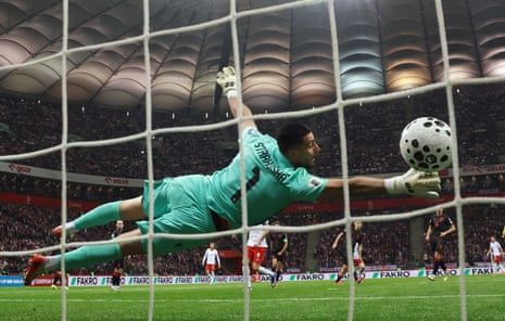 Albania’s Thomas Strakosha is beaten by a Piotr Zielinski shot for Poland.
