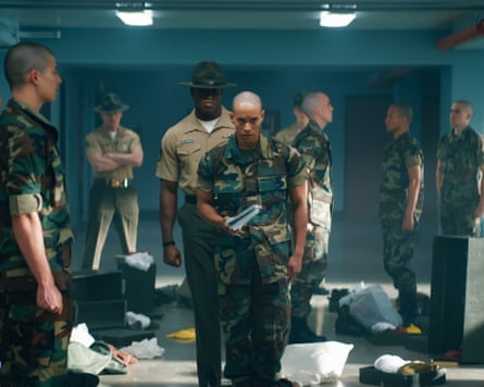 A film still from Netflix’s Boots, in which a group of soldiers stand while one of them walks towards the camera.