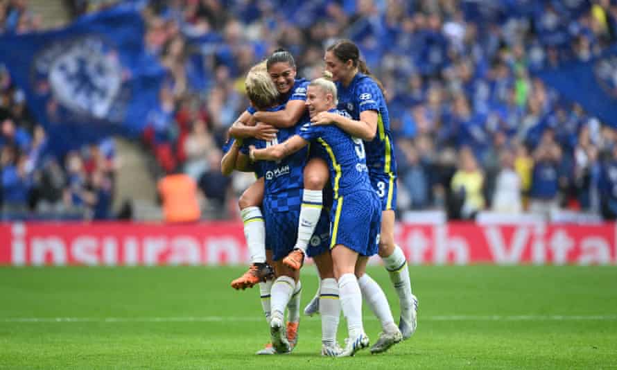 Millie Bright is congratulated by her Chelsea team-mates.