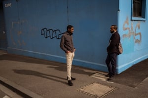 Community health worker Ahmed Dini and colleague Nor Shanino discuss a proposed call centre to help with the mental health and concerns of residents in Flemington and North Melbourne housing commission flats.