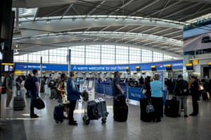 Passengers queue to check-in for their flights at Heathrow Airport’s Terminal 5 in west London, this month