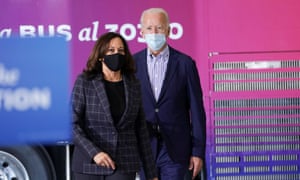 The US Democratic presidential candidate, Joe Biden, and vice presidential candidate, Kamala Harris, pass a campaign tour bus as they arrive to speak at a carpenters’ union in Phoenix, Arizona on 8 October.