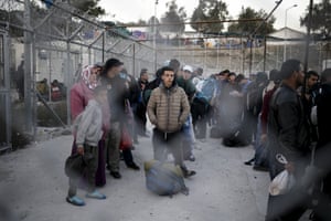 Refugees and migrants wait to be registered at Moria refugee camp on the Greek island of Lesbos in November 2015