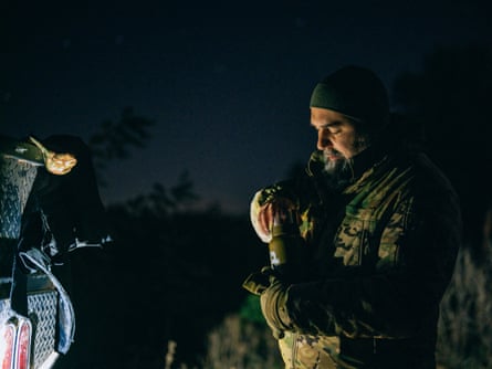 Oleksandr sharing tea during the night shift near Kyiv.