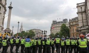 Police line up against protesters in Trafalgar Square, marching to demand Tommy Robinson be freed from prison, 9 June 2018