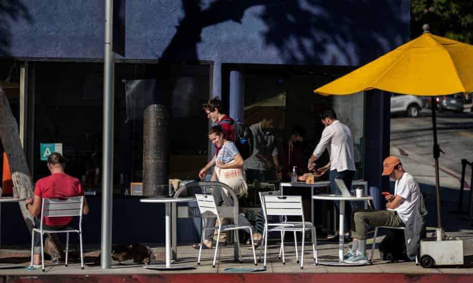 Patrons enjoy the outdoor seating at the Go Get em Tiger cafe in West Hollywood, California. Cafe workers will soon be able to take advantage of the increase in minimum wage in West Hollywood.