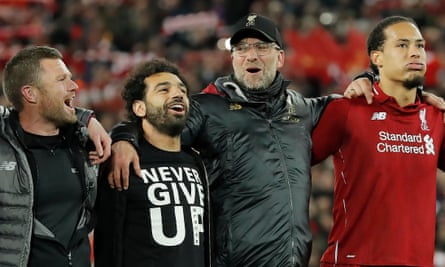 Virgil van Dijk (right) looks out in wonder as Jürgen Klopp and Mohamed Salah sings ‘You’ll Never Walk Alone’ in front of the Kop.
