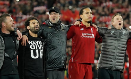 Jürgen Klopp (centre) sings You’ll Never Walk Alone in front of the Kop next to Mohamaed Salah and Virgil van Dijk after the Champions League semi-final second leg match between Liverpool and Barcelona at Anfield on 7 May 2019