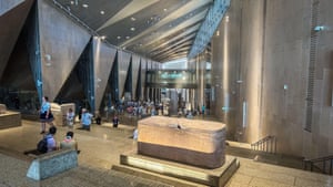 Visitors bustle in a hall at the Grand Egyptian Museum