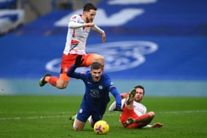 Timo Werner of Chelsea is tackled by Jordan Clark of Luton Town leading to a penalty.