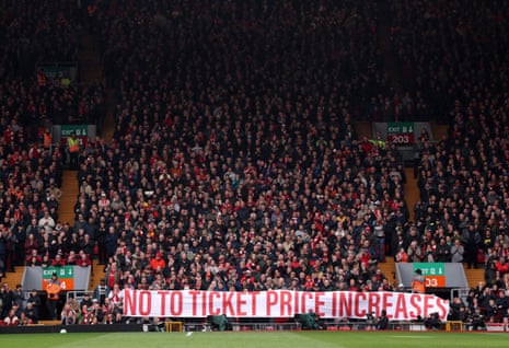 Fans of Liverpool display a banner in protest at the raising of ticket prices