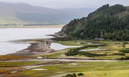 A Scotrail train crosses the glacial delta estuary of the River Attadale on the Kyle of Lochalsh railway line in the Highlands of Scotland.
