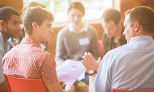 A man talking in a group therapy session