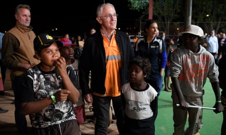 Prime Minister Malcolm Turnbull meets local kids as he rides along in a Julalikari Youth Night Patrol convoy, at Tennant Creek, in the Northern Territory, Sunday, 22 July 2018