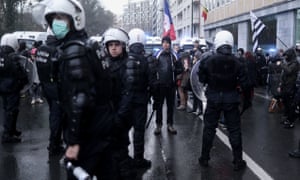 Belgian riot police face participants of the so-called “Freedom Convoy” (Convoi de la Liberte) during an unauthorised demonstration in the centre of Brussels on Monday
