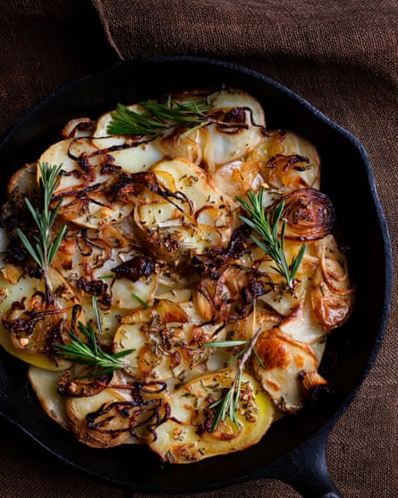 ‘Brought to the table in a cast-iron pan’: potatoes with olive oil, garlic and rosemary.