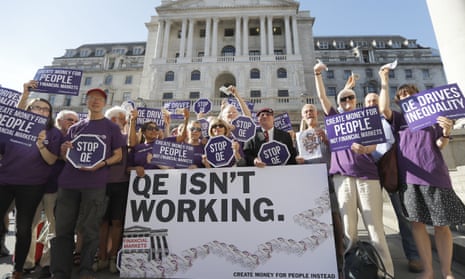 Positive Money campaigners protest against quantitative easing in front of the Bank of England in 2016.