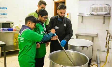 Jewish and Muslim volunteers prepare the soup for distribution to homeless centres.