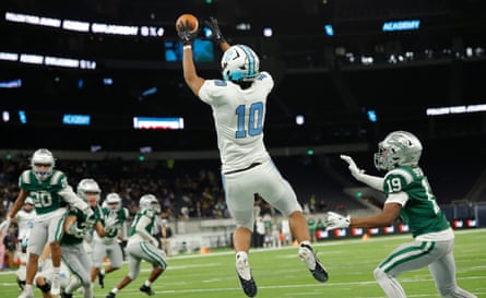 NFL Academy player Seb Harris from London catches the ball for a touchdown but it was cancelled out due to a penalty during the match NFL Academy against De La Salle Spartans at the Tottenham Hotspur Stadium.