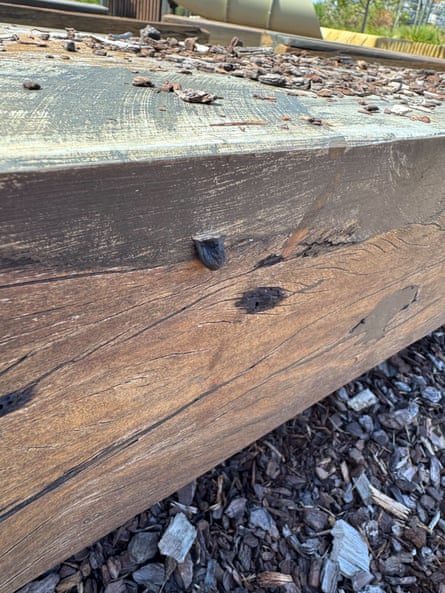 A timber beam which appears to be emitting a black substance