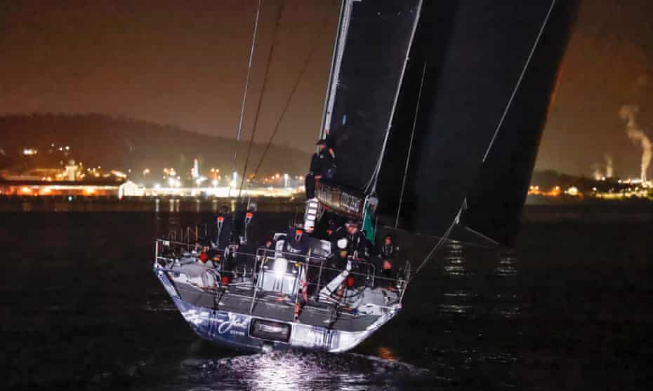 BlackJack approaches the finish line of the Sydney to Hobart yacht race in darkness in the early hours of Wednesday morning.