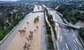 An aerial view of the Los Angeles River swollen by storm runoff after powerful storms hit southern California in February