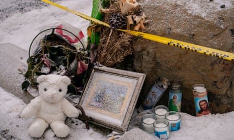 Objects are left for a makeshift memorial at the site of the slayings in Moscow, Idaho.